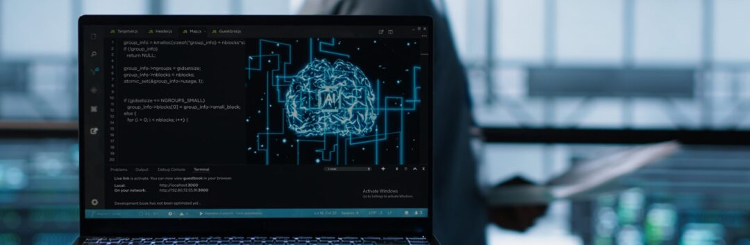 Artificial intelligence technology coding on laptop in data center with programmers in background employing machine learning models. Notebook used by AI IT experts, camera A close up